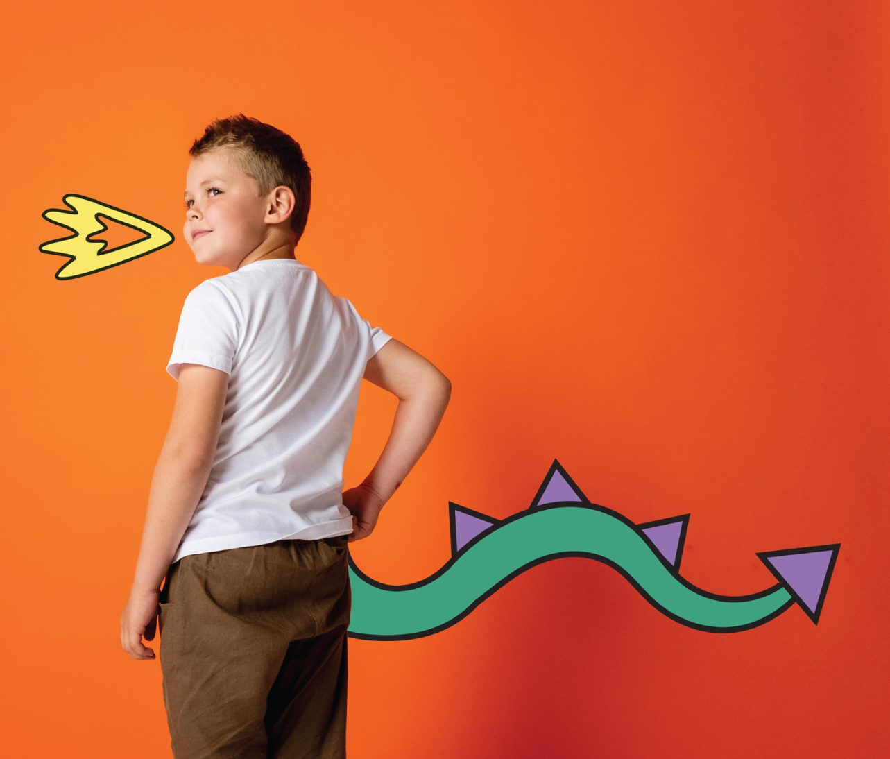 Boy with animated green and purple dragon tail coming from his back - imaginative play