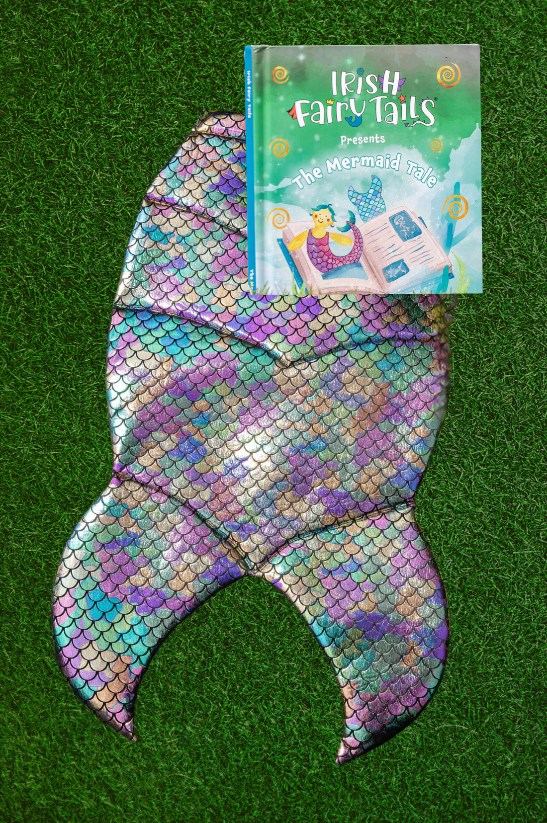 Mermaid tail with a book titled The Mermaid Tale by &