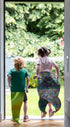kids jumping into garden wearing costume tails